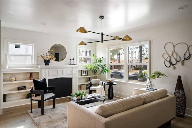 living room featuring hardwood / wood-style floors and a chandelier