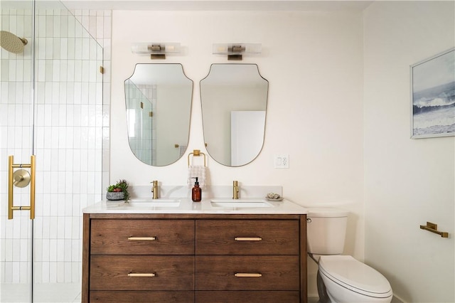 bathroom with vanity, an enclosed shower, and toilet