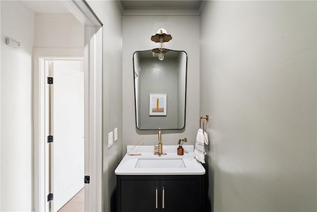 bathroom featuring vanity and crown molding