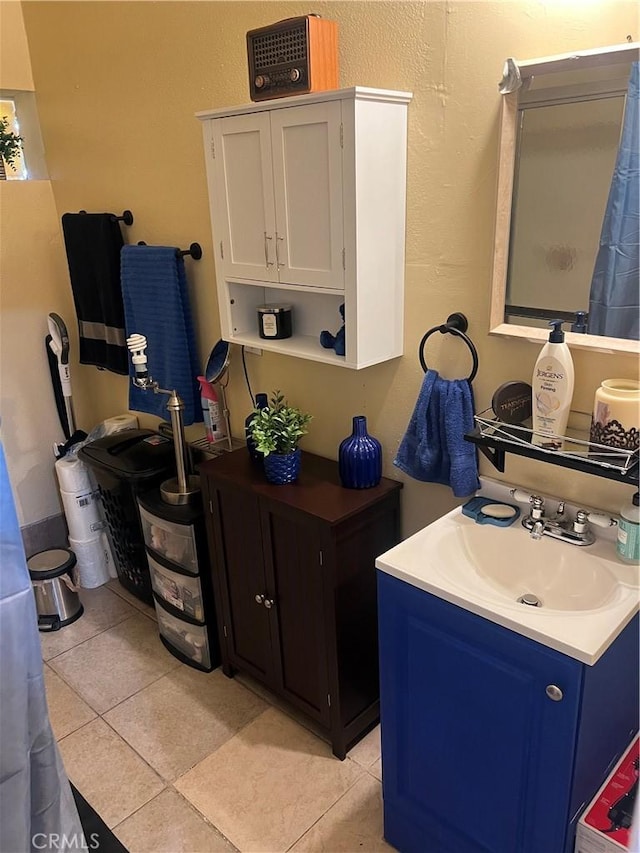 bathroom with tile patterned flooring and vanity