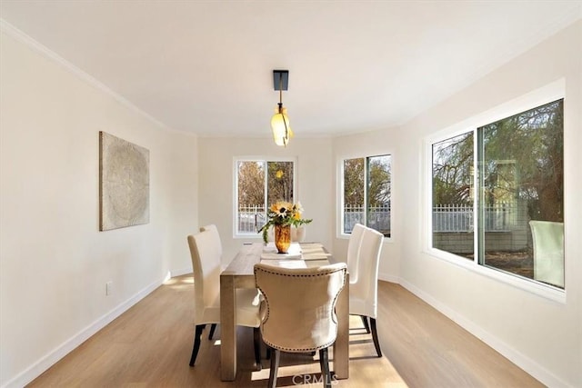 dining space featuring light wood-type flooring