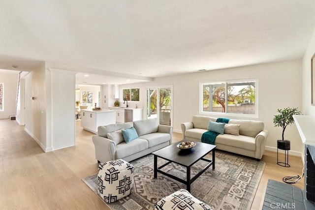 living room with light hardwood / wood-style flooring