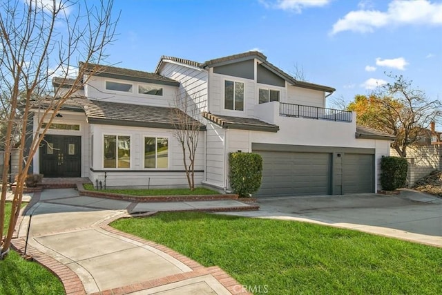 view of front of property with a garage and a front yard