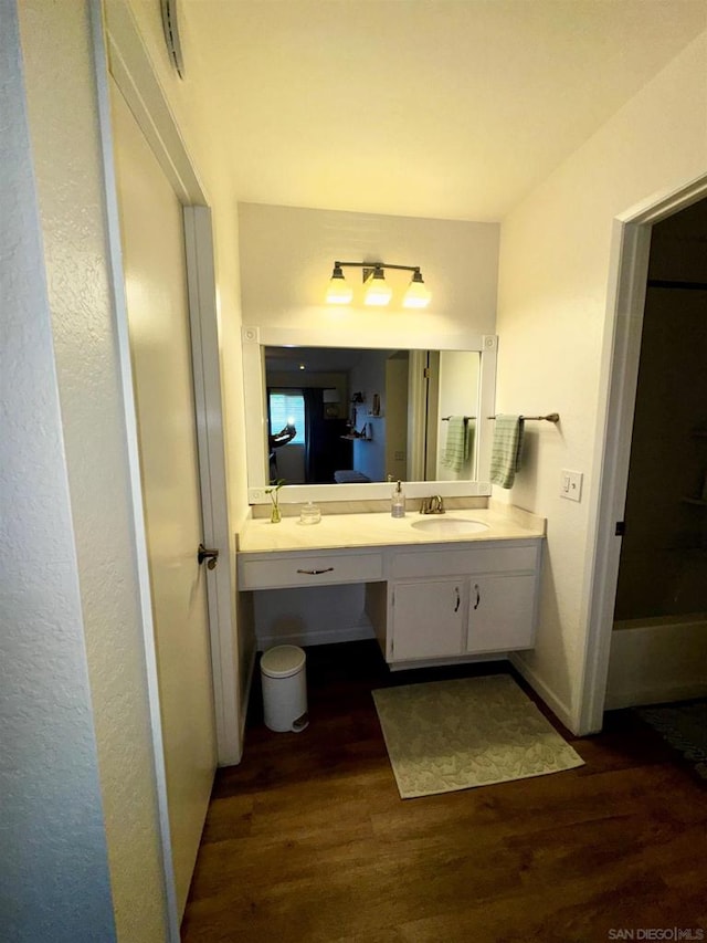 bathroom featuring vanity and hardwood / wood-style floors