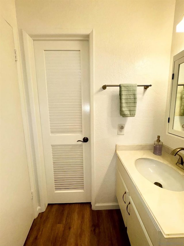 bathroom featuring wood-type flooring and vanity