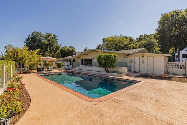 view of pool featuring a patio