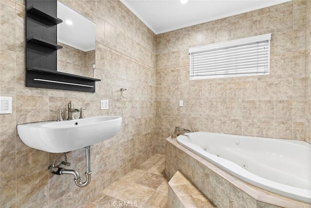 bathroom with sink, tile walls, and tiled tub