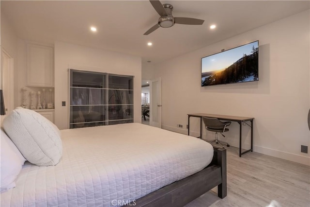 bedroom with ceiling fan and light hardwood / wood-style floors