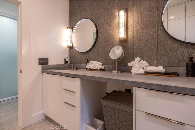 bathroom with vanity and hardwood / wood-style floors