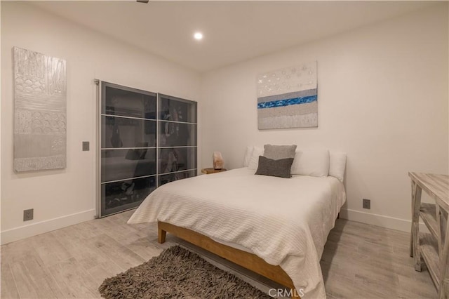 bedroom with light hardwood / wood-style floors