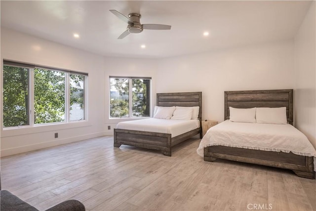 bedroom featuring ceiling fan and light hardwood / wood-style floors