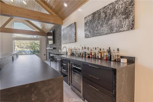 bar featuring a fireplace, sink, wood ceiling, lofted ceiling with beams, and beverage cooler