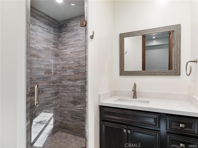 bathroom with vanity and walk in shower