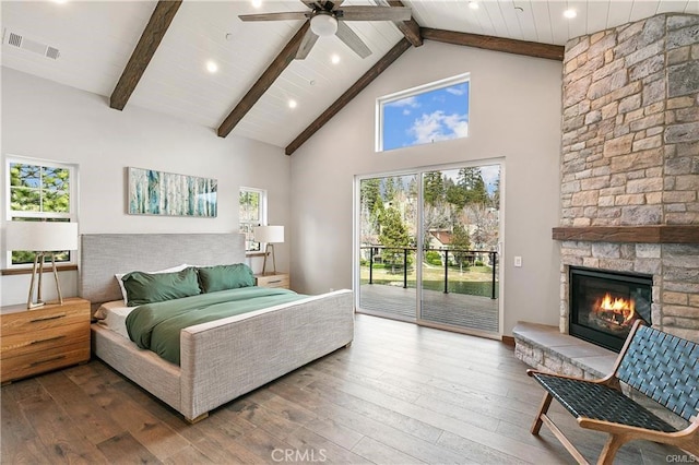 bedroom with hardwood / wood-style flooring, access to outside, high vaulted ceiling, and ceiling fan