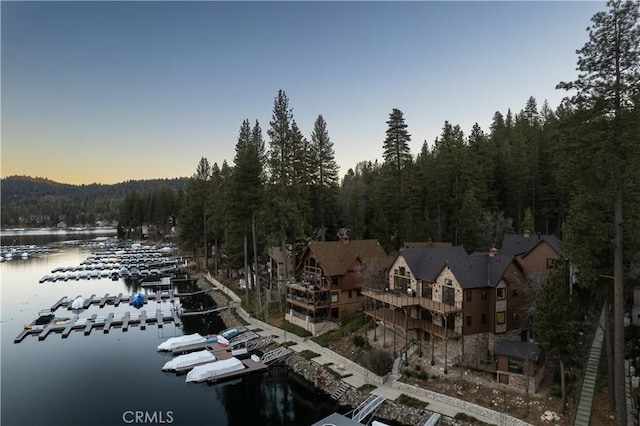 aerial view at dusk with a water view