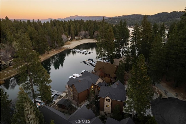 aerial view at dusk with a water and mountain view