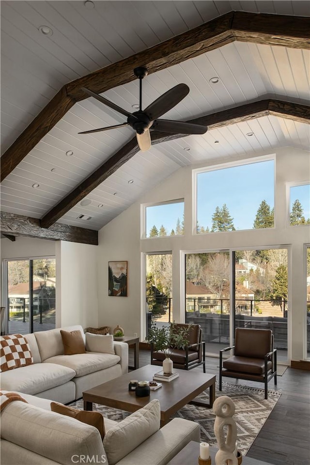 living room featuring hardwood / wood-style flooring, ceiling fan, high vaulted ceiling, and beam ceiling