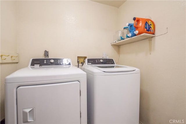 laundry room with separate washer and dryer