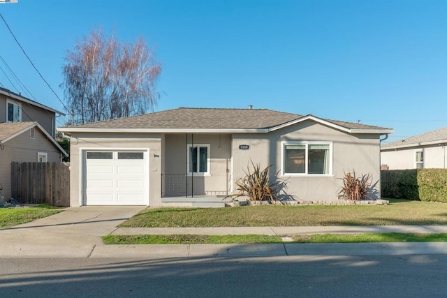 view of front of property with a garage and a front yard