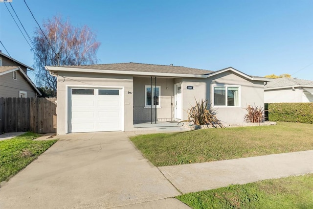 ranch-style house featuring a garage and a front yard