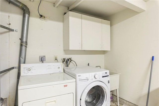 laundry area with cabinet space and washing machine and dryer