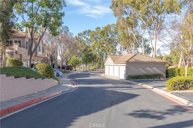 view of road featuring curbs