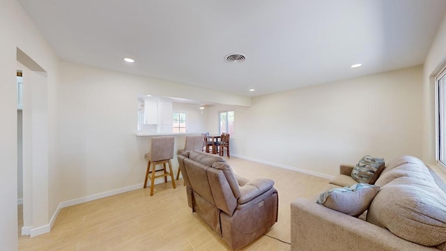 living room with light hardwood / wood-style floors