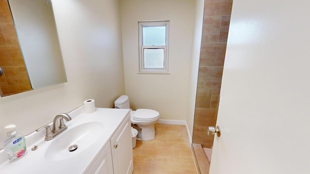 bathroom featuring vanity, toilet, and tile patterned flooring