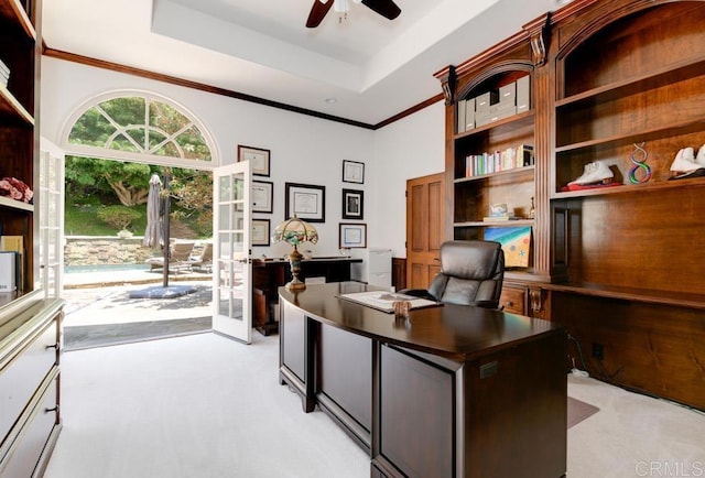 home office with french doors, light carpet, ceiling fan, and a tray ceiling