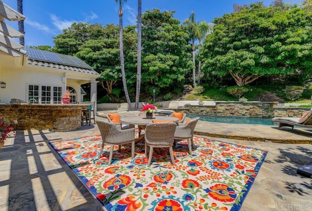 view of patio with a bar