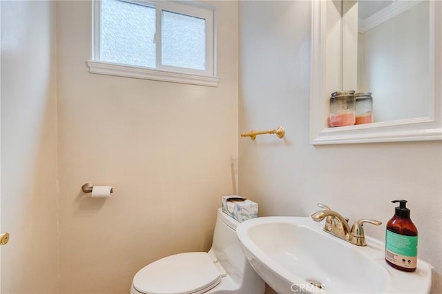 bathroom with sink and toilet