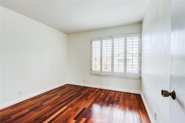 empty room featuring dark hardwood / wood-style floors