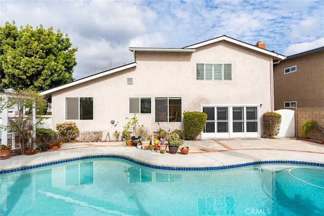 back of property featuring a patio