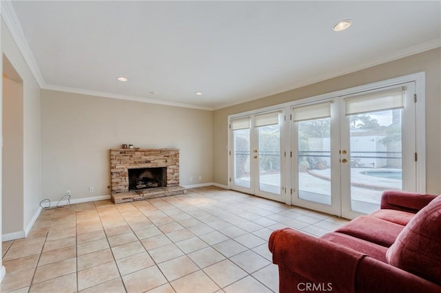 tiled living room with crown molding, a stone fireplace, and french doors