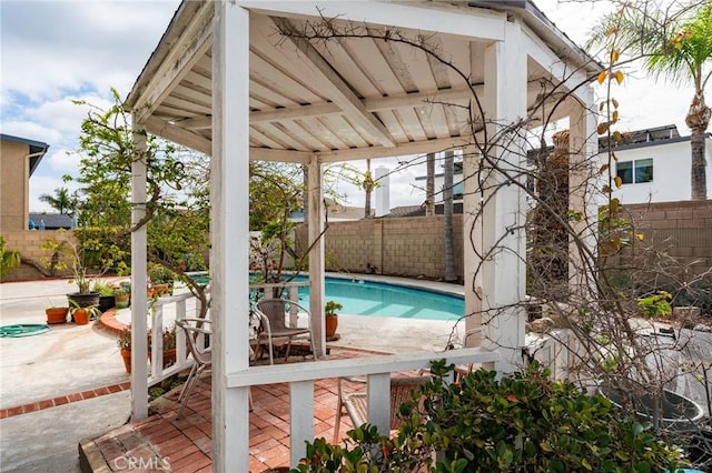 view of swimming pool featuring a patio area