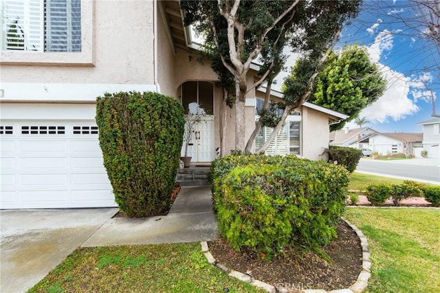 view of exterior entry with a garage