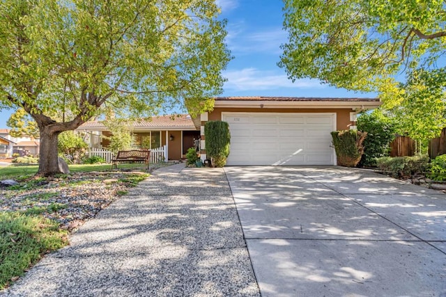 single story home featuring a garage