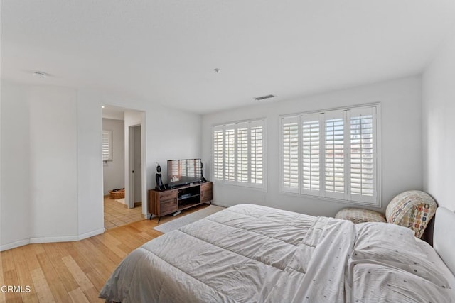 bedroom with light hardwood / wood-style floors