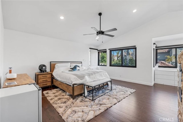 bedroom with dark wood-type flooring, ceiling fan, and lofted ceiling