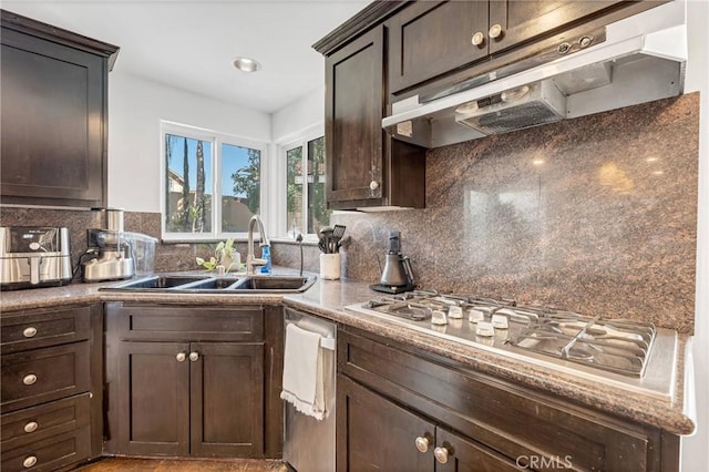 kitchen with dark brown cabinetry, sink, stainless steel gas cooktop, and backsplash