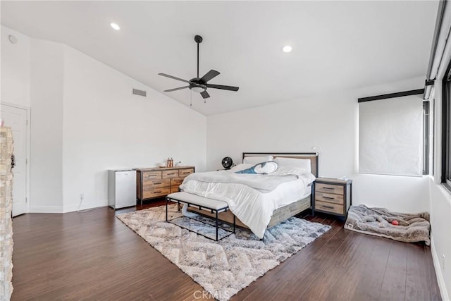 bedroom featuring dark wood-type flooring, high vaulted ceiling, ceiling fan, and refrigerator