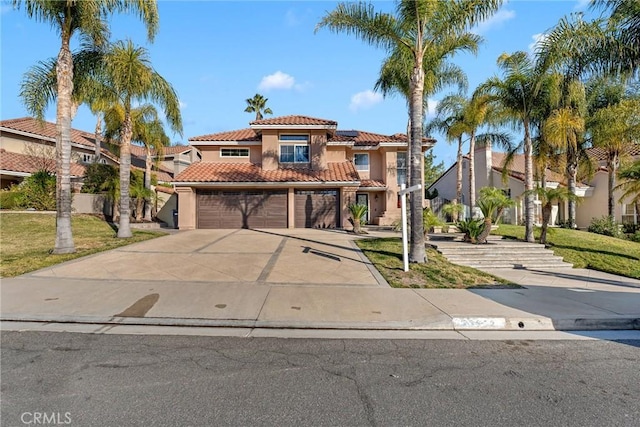 mediterranean / spanish-style home featuring a garage