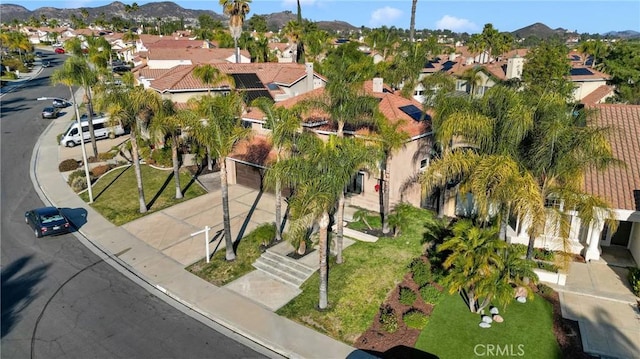 birds eye view of property with a mountain view