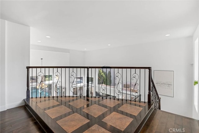 corridor featuring dark hardwood / wood-style flooring