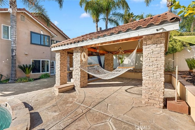 view of patio featuring ceiling fan