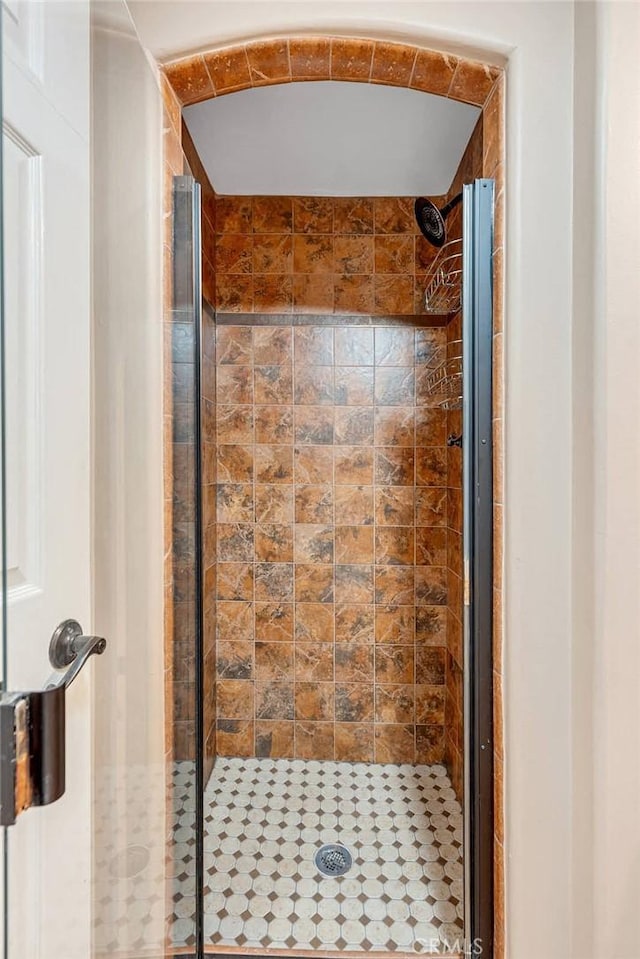 bathroom featuring an enclosed shower