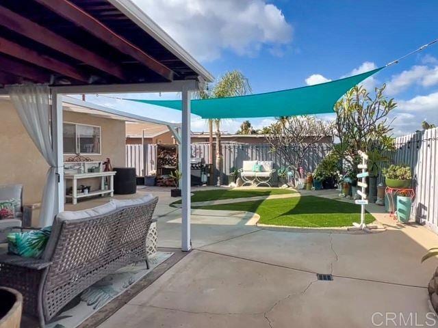 view of patio / terrace featuring fence