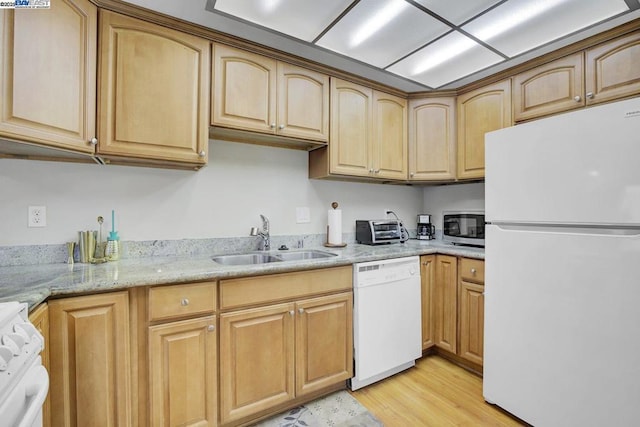 kitchen with sink, light hardwood / wood-style flooring, light brown cabinets, white appliances, and light stone countertops