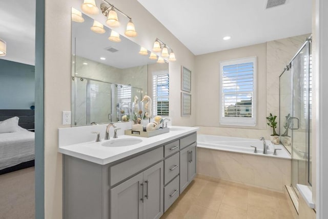 bathroom featuring vanity, tile patterned floors, and independent shower and bath