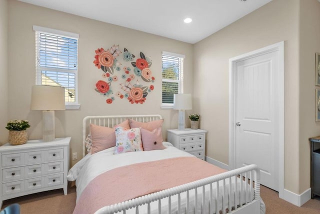 bedroom featuring light carpet